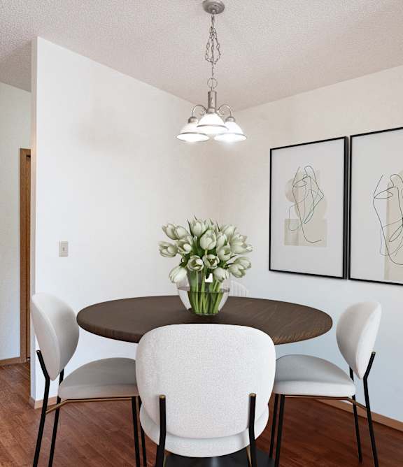 a dining room with a table and chairs