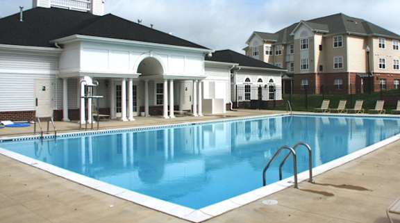 a large swimming pool in front of a building at Overland Gardens, Landover, MD