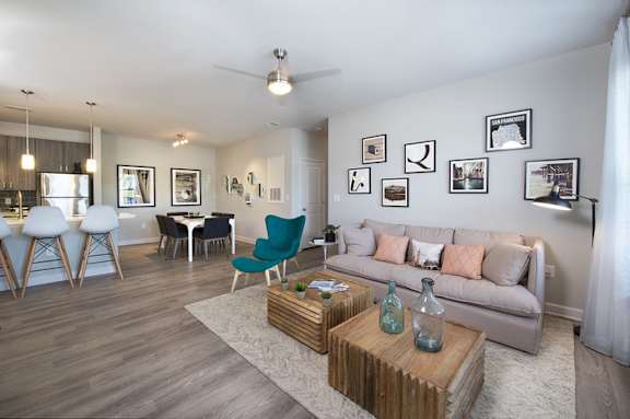 Spacious living room with hardwood-inspired flooring