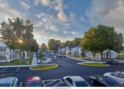 Thumbnail 2 of 6 - a rendering of a neighborhood with cars parked on the street