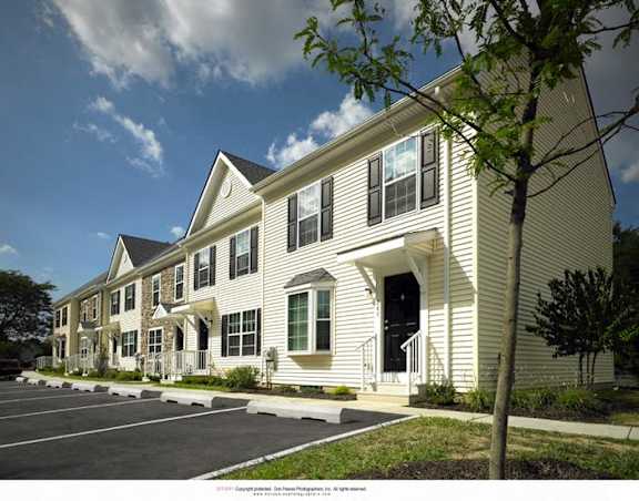 a rendering of a building with a parking lot