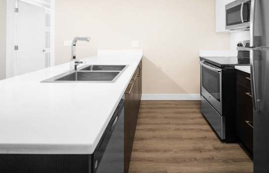Well-appointed kitchen with stainless steel appliance package.