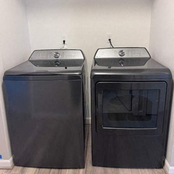 Two black ovens are side by side.