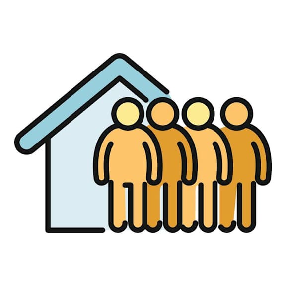 A family of four standing in front of a house.