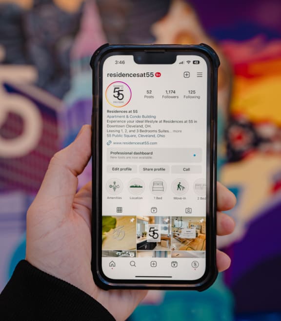 a hand holding an iphone with the settings app on the screen