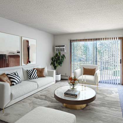 a living room with a white couch and a coffee table