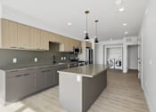 Thumbnail 3 of 51 - Kitchen with island and pendant lights at Brickside Heights, Millcreek