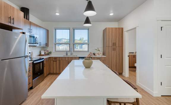 Kitchen with Dark Accents at Maye House Apartments