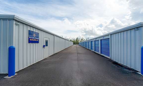 A long row of storage units with blue trim.