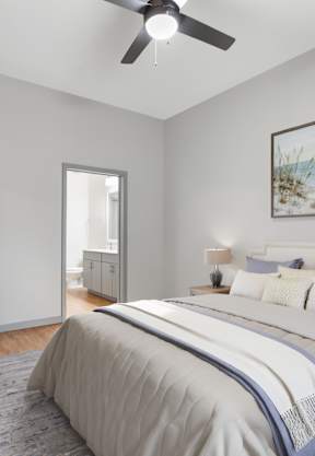 a bedroom with a bed and a painting on the wall at The District at Rosemary, Sarasota, FL, 34236