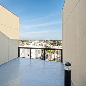 A balcony with a view of the cityscape.
