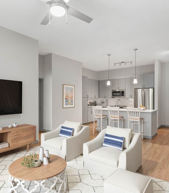 a living room with a gray couch and a large window at The District at Rosemary, Florida