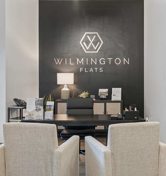 A modern building with a glass facade and a brick exterior at Wilmington Flats Apartments, Salt Lake City, UT