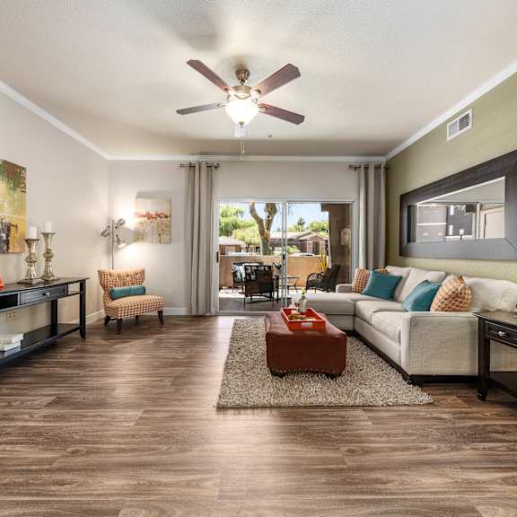 A living room with a brown leather couch and a coffee table.