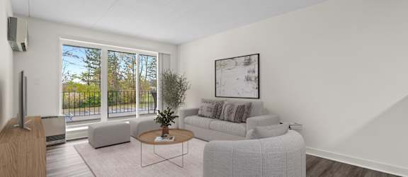 A living room with a grey sofa and a coffee table.