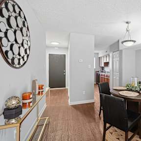 A dining room with a round table and chairs. at Emory Woods, North Carolina, 27713