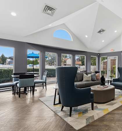 A modern living room with a large window and a skylight.