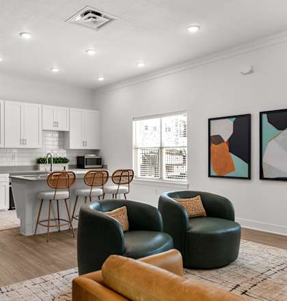 A modern kitchen with a dining area and a living room.