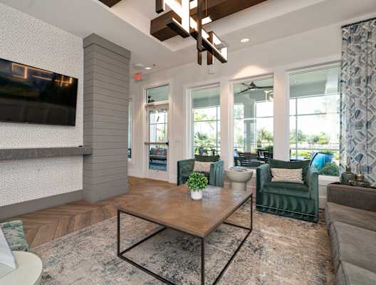 a living room with a coffee table and a television