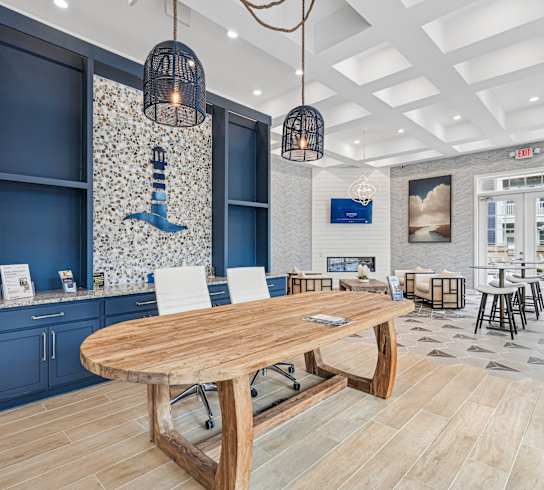 A modern dining area with a wooden table and chairs.