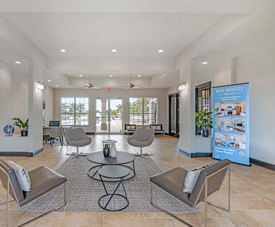 A spacious waiting area with a sign that says