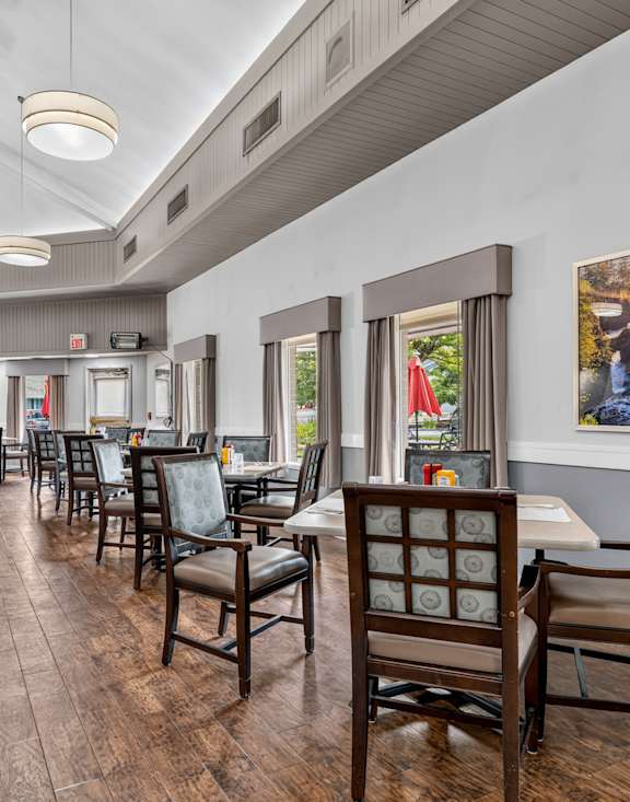 A balcony with a chair and a sofa. at King City Senior Village Apartments, King City, Oregon