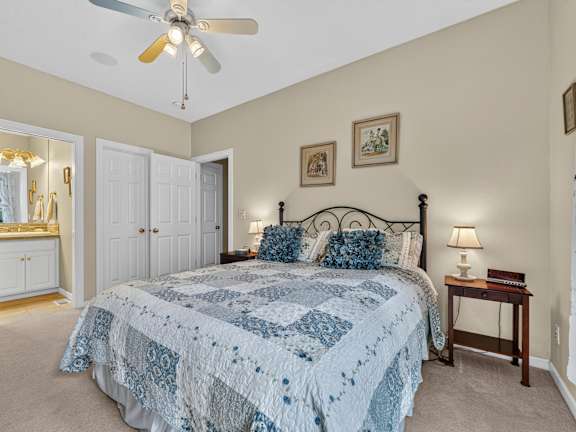 A kitchen with a granite countertop and stainless steel appliances. at King City Senior Village Apartments, King City, Oregon