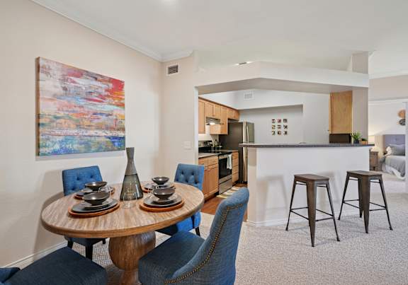 A spacious living room with a brick pillar and a glass door.