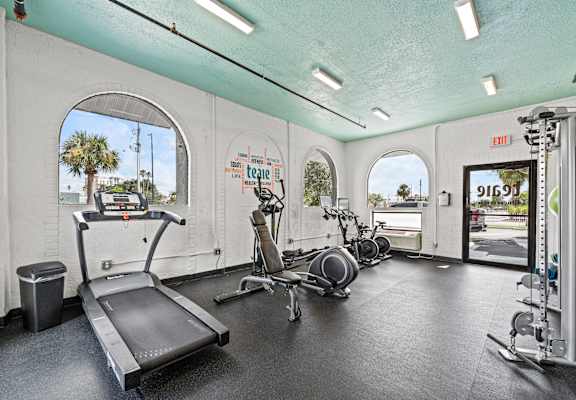 A gym with treadmills, exercise bikes and other equipment at The Teale, Kissimmee, FL, 34746