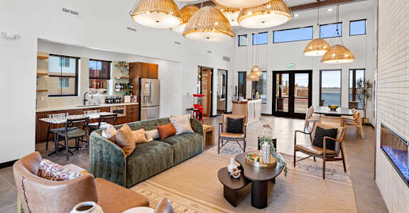 A living room with a green couch and a coffee table.