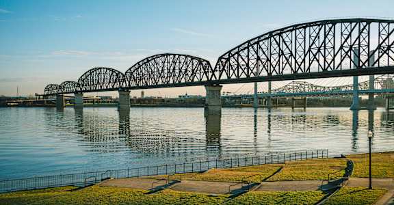 a bridge over the water with a river
