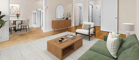 A living room with a green couch and a coffee table.