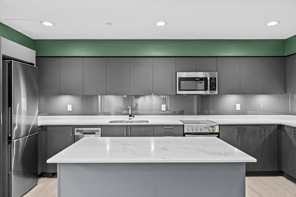 A modern kitchen with a large island in the center.