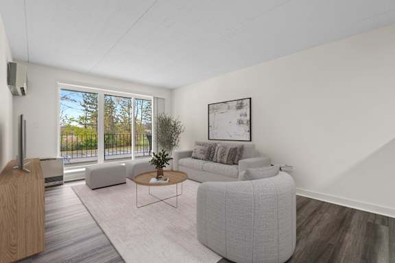 A living room with a grey sofa and a coffee table.