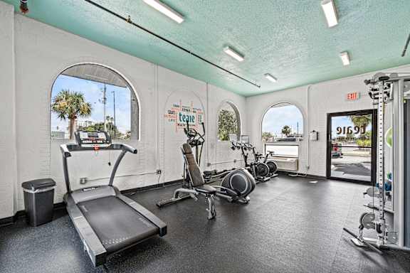 A gym with treadmills, exercise bikes and other equipment at The Teale, Kissimmee, FL, 34746