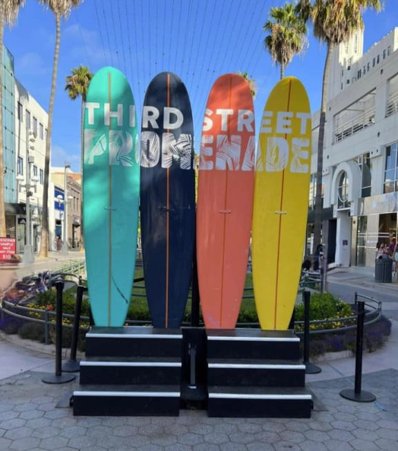 four surfboards on display in front of a building