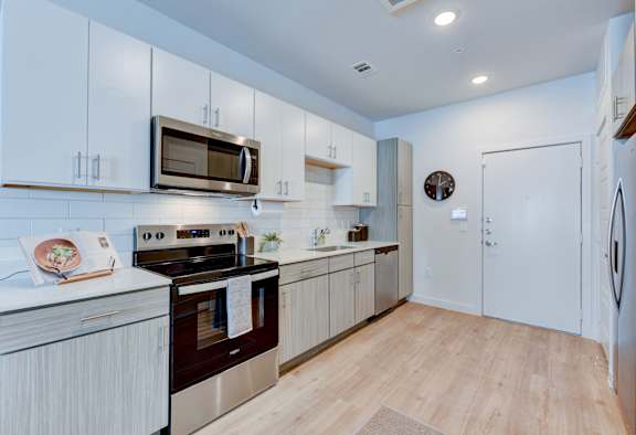 Modern Kitchens and All Vinyl Flooring at Park South Apartments in South Austin, Texas 78748