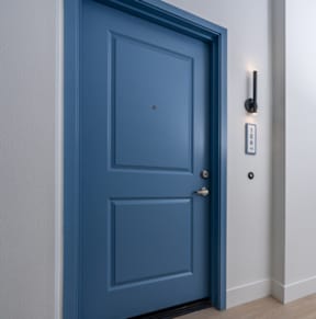 A blue door with a white wall