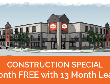 a graphic of a building with the words construction special 1 month free with 13 month lease
