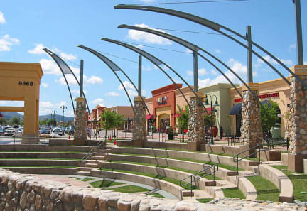 a shopping mall with steps and a fountain