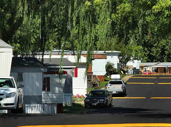 a group of cars parked in front of a house