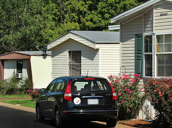 a car parked in front of a house