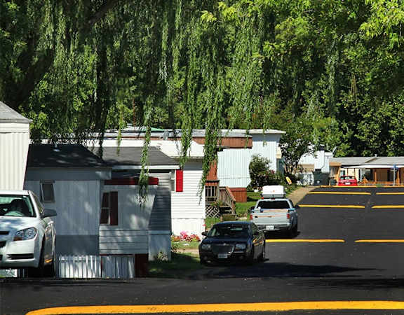 a group of cars parked in front of a house