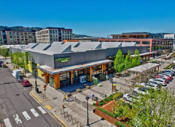 an aerial view of a shopping center with a parking lot at The Weidler in Portland, OR 97209