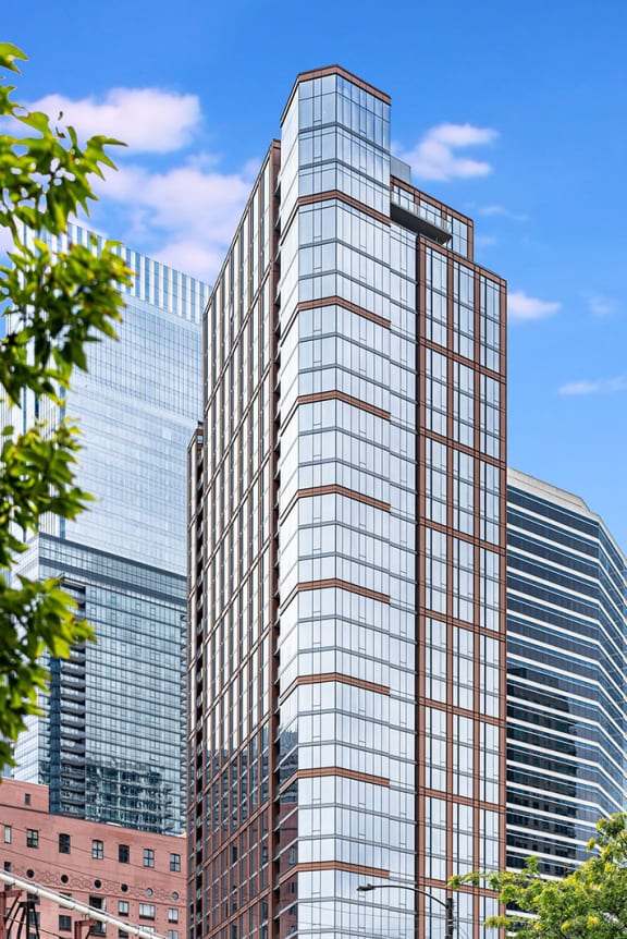 a tall skyscraper with a blue sky in the background at Cassidy on Canal, Chicago, Illinois, 60654