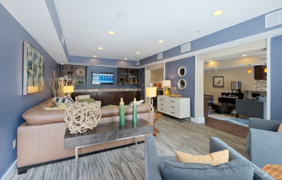 a living room filled with furniture and a large window