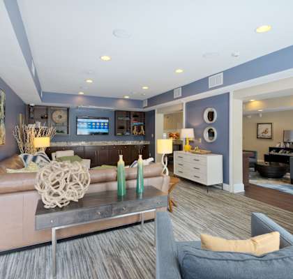 a living room filled with furniture and a large window