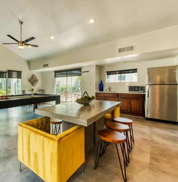 a large kitchen with a large island and a pool table at Connect on Northern, Glendale