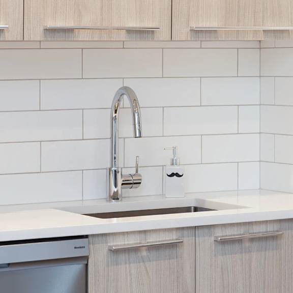 Kitchen with a White Counter at The Grove Apartments, New York, 11102