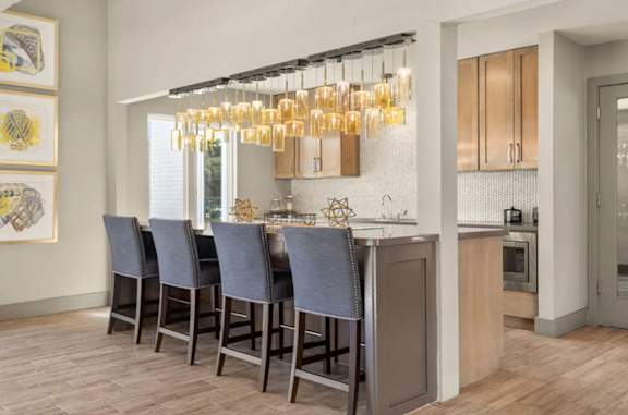 a living room with a table and chairs at South Lamar Village in Austin, 78704
